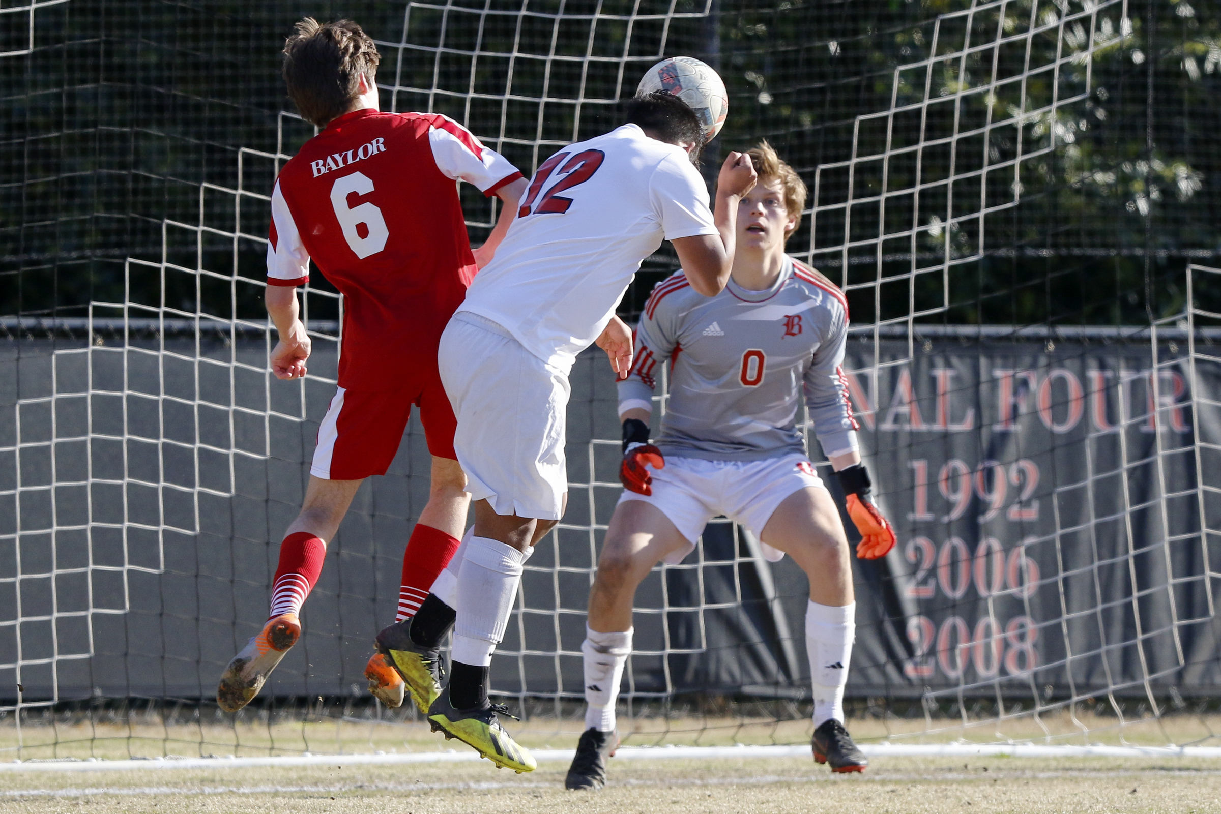 Dalton's Harrison Fraire (12) heads in a goal past Aiden Yelton (6) and Charlie Hooks (0) in the Catamounts' 4-1 victory Tuesday at Baylor.