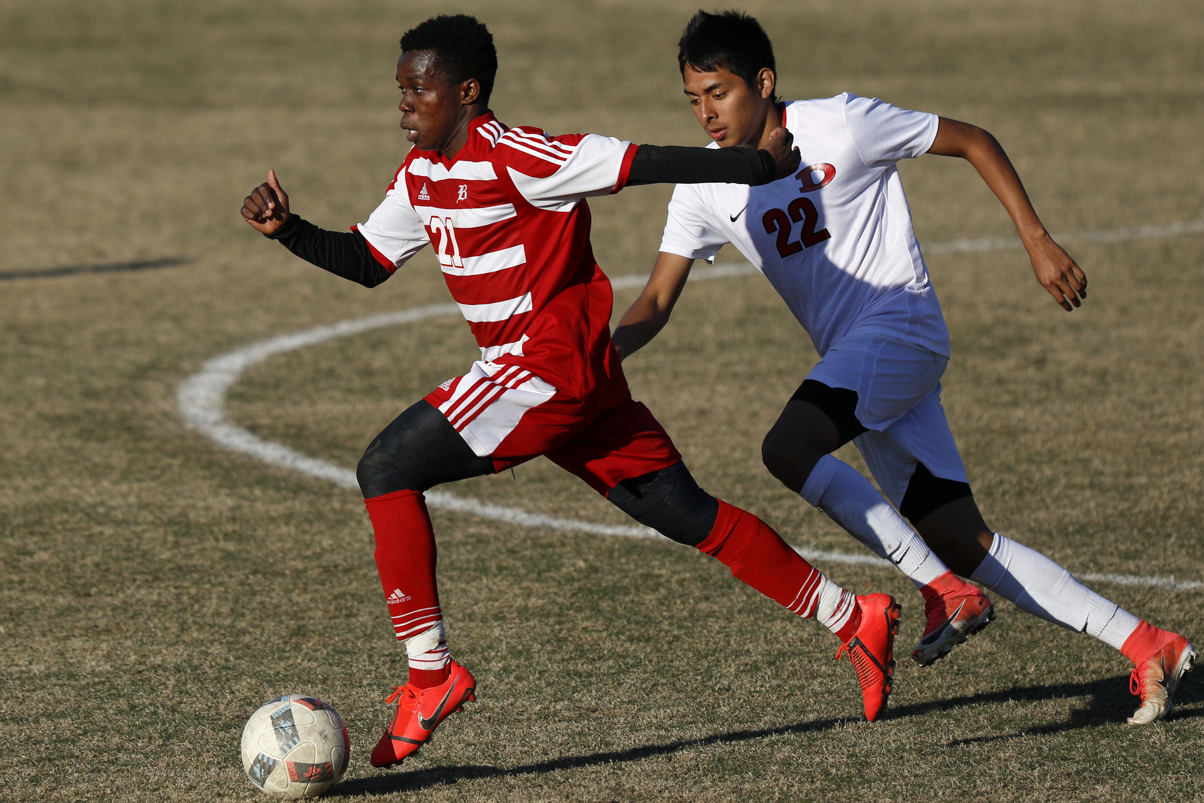 Dalton's Elvis Perez (22) pursues Baylor's David Danquah (21) at Baylor School on Tuesday, April 2, 2019 in Chattanooga, Tenn.