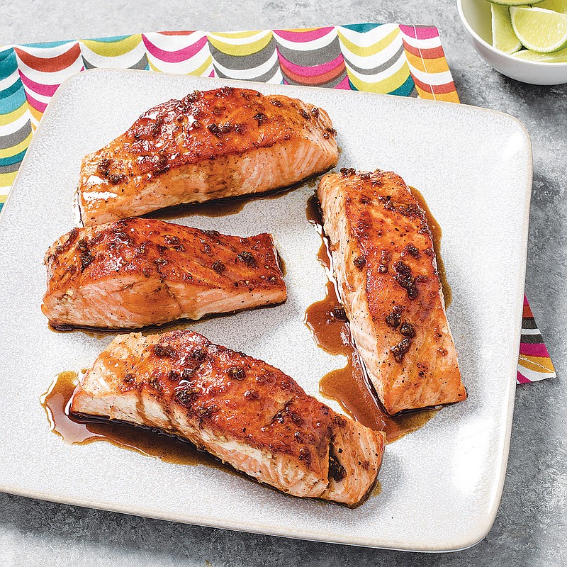 This undated photo provided by America's Test Kitchen in March 2019 shows Sweet And Tangy Glazed Salmon in Brookline, Mass. This recipe appears in "The Complete Cookbook for Young Chefs." (Carl Tremblay/America's Test Kitchen via AP)