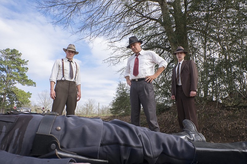 This image released by Netflix shows, from left, Woody Harrelson, Kevin Costner and Thomas Mann in a scene from "The Highwaymen." (Merrick Morton/Netflix via AP)
