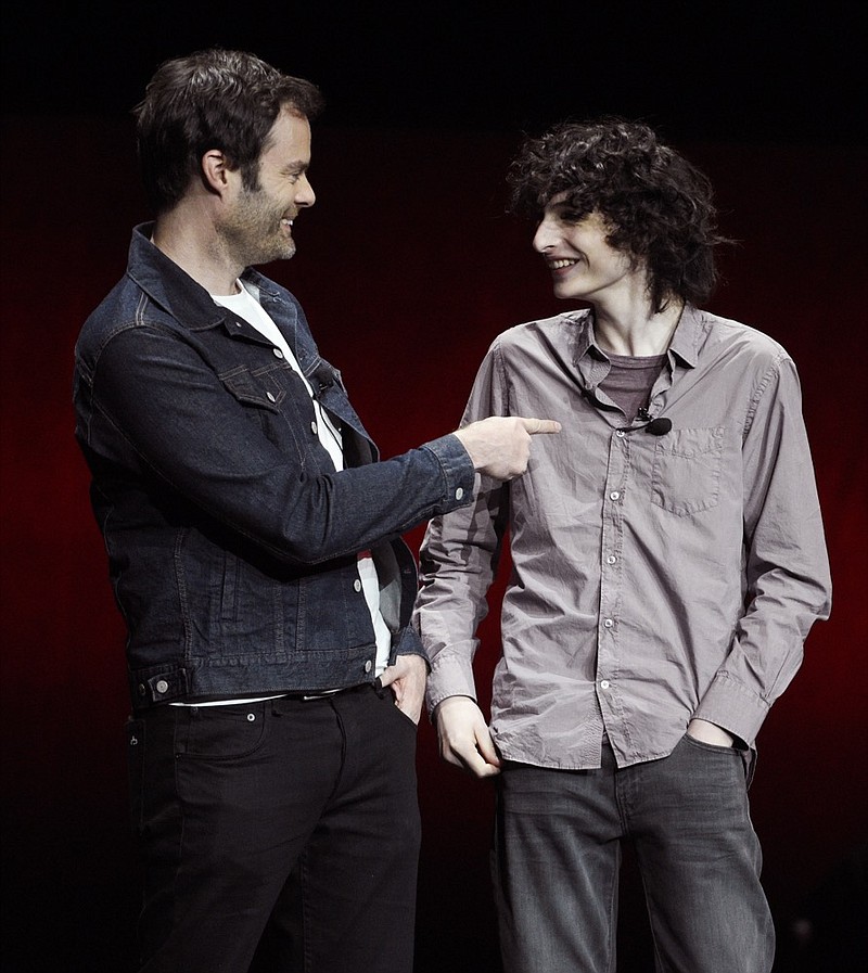 Bill Hader, left, and Finn Wolfhard, cast members in the upcoming film "It: Chapter Two," mingle onstage during the Warner Bros. presentation at CinemaCon 2019, the official convention of the National Association of Theatre Owners (NATO) at Caesars Palace, Tuesday, April 2, 2019, in Las Vegas. (Photo by Chris Pizzello/Invision/AP)

