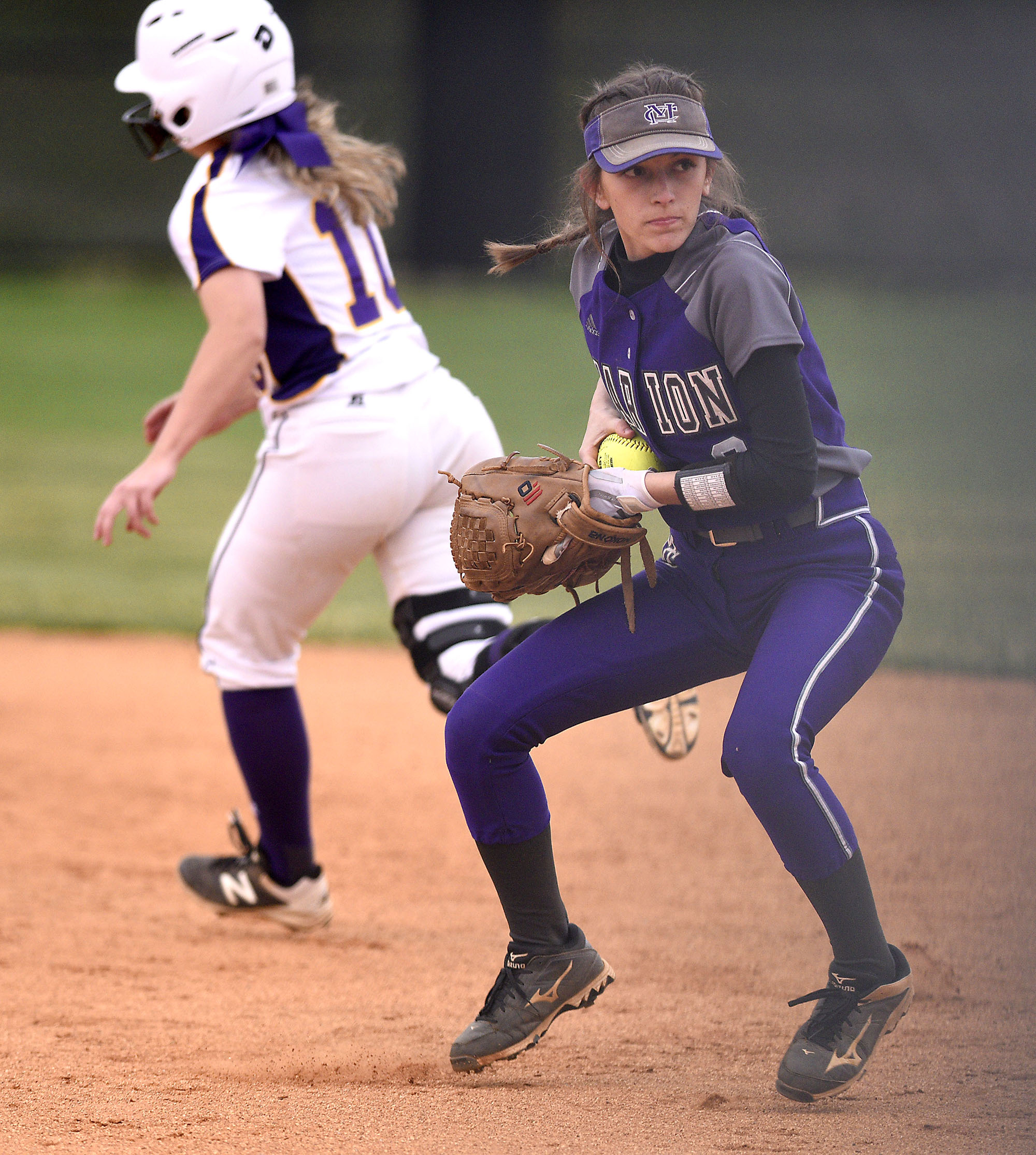 Marion second baseman Grace Sneed (8) looks to throw to first as Sequatchie's Tori Shell (10) heads to second. The Marion County High Lady Warriors visited the Sequatchie County Lady Indians in TSSAA softball action on April 4, 2019.
