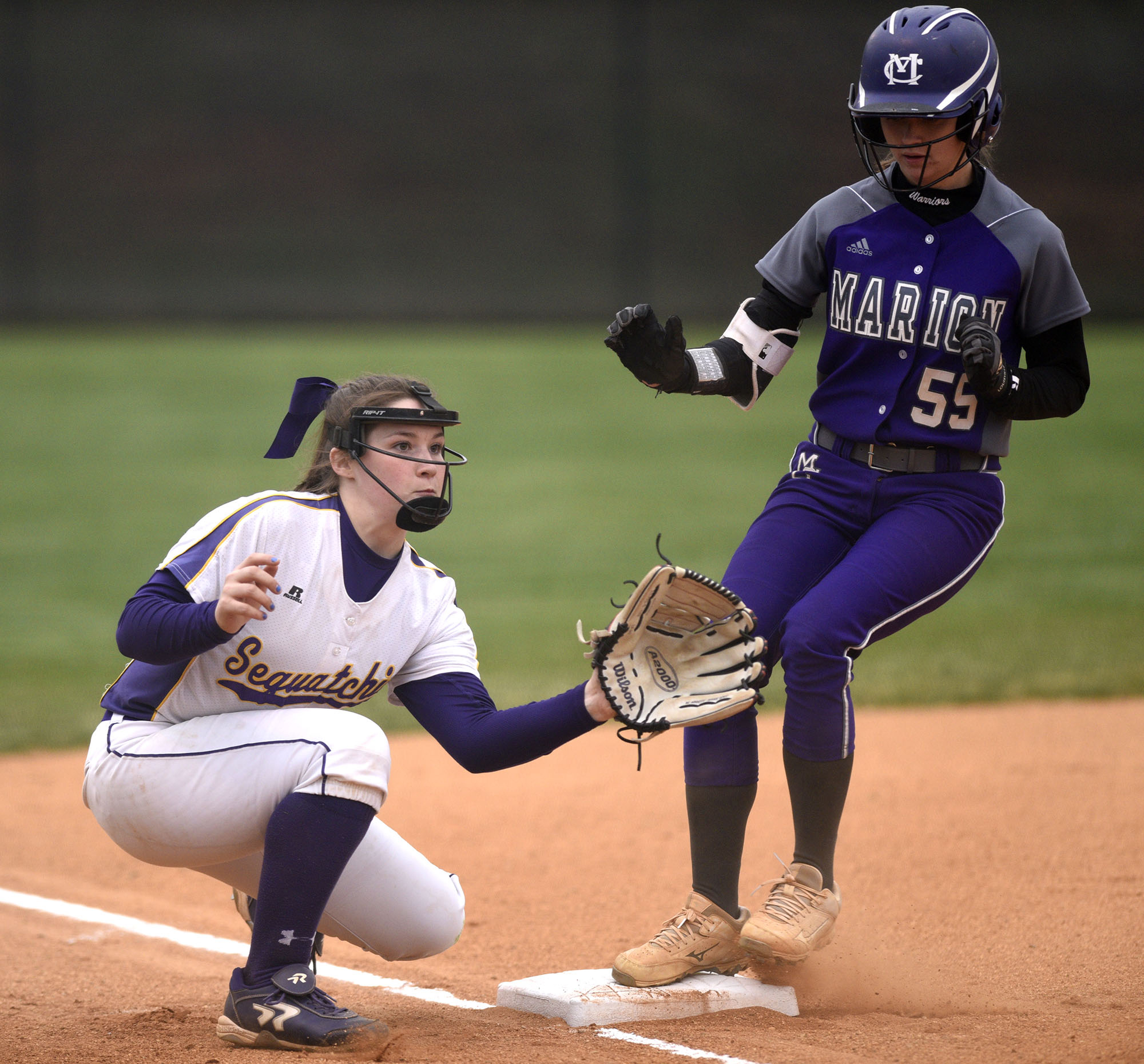 Marion's Savannah Thomas (55) is safely into third as Sequatchie's Abbie McGowan (14) awaits the throws. The Marion County High Lady Warriors visited the Sequatchie County Lady Indians in TSSAA softball action on April 4, 2019.