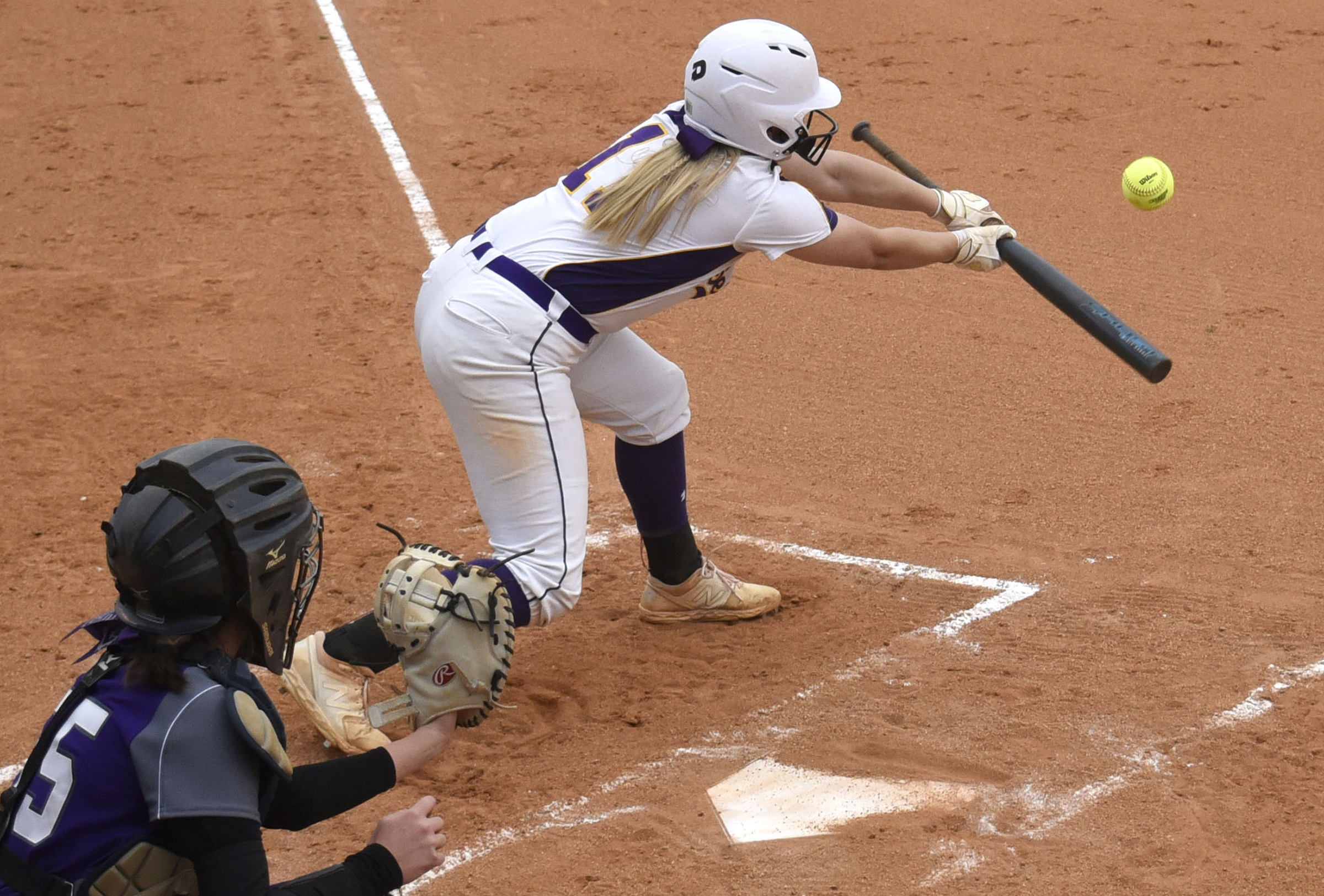 Sequatchie's Peyton Longson (11) attempts to bunt. Behind the plater for Marion is Savannah Thomas (55). The Marion County High Lady Warriors visited the Sequatchie County Lady Indians in TSSAA softball action on April 4, 2019.