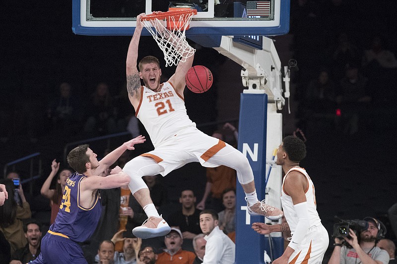 Texas forward Dylan Osetkowski dunks during the second half of the NIT title game against Lipscomb on Thursday night at Madison Square Garden in New York. Texas won 81-66.