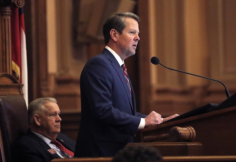 Georgia Gov. Brian Kemp, right, speaks to members of the Georgia House as House Speaker David Ralston looks on during the final 2019 legislative session at the State Capitol Tuesday, April 2, 2019, in Atlanta. (AP Photo/John Bazemore)

