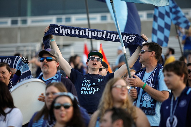 Chattanooga FC fans in the Chattahooligans' supporters section cheer before Saturday's home match against Detroit City FC at Finley Stadium.