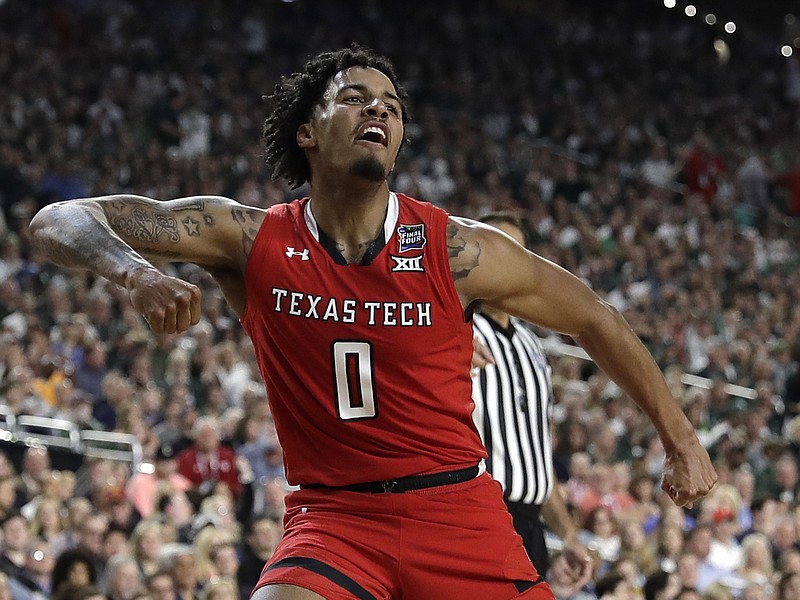 Texas Tech guard Kyler Edwards celebrates during the second half of the Red Raiders' Final Four matchup with Michigan State on Saturday night in Minneapolis.