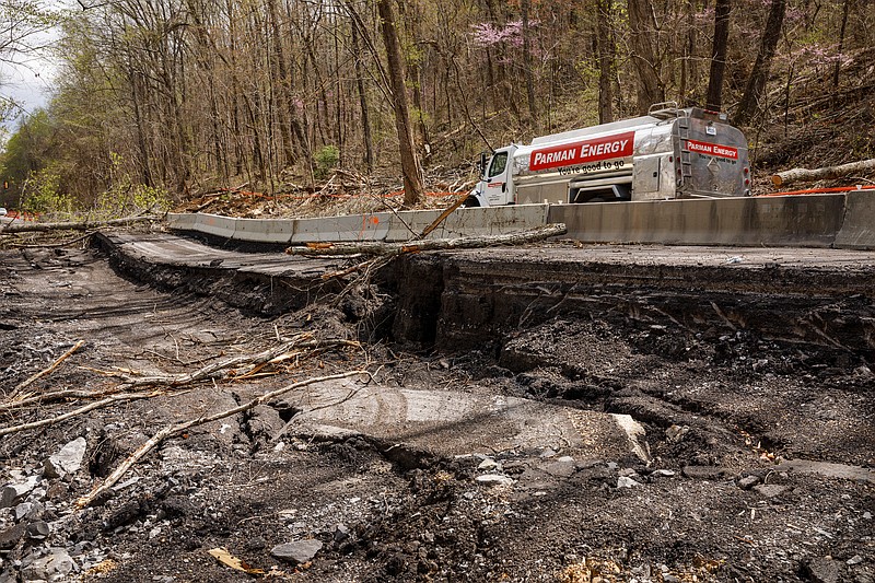 a collapsed portion of U.S. Highway 41 between Halegown in Marion County and Tiftonia in Hamilton County on Tuesday, April 2, 2019, near Chattanooga, Tenn. TDOT has constructed a temporary one-lane road with traffic signals to bypass the collapsed portion of road.