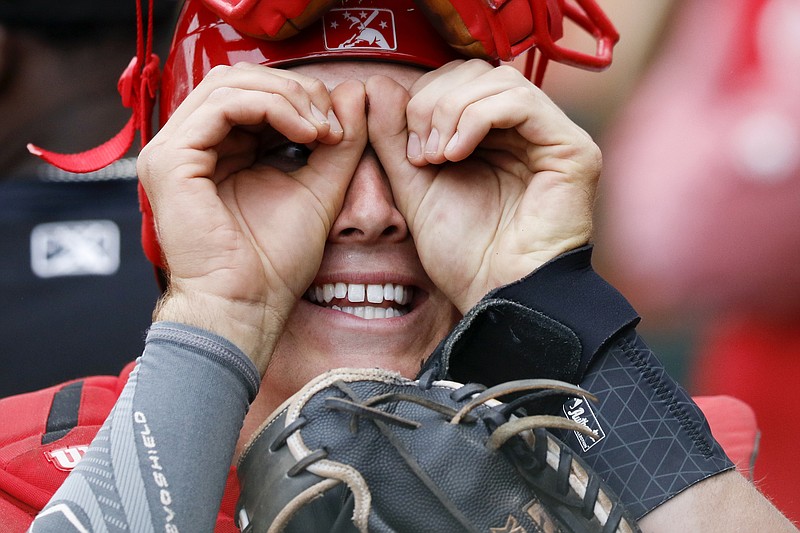 Chattanooga Lookouts catcher Tyler Stephenson cuts up with teammates in the dugout before Thursday's game against the Montgomery Biscuits at AT&T Field.