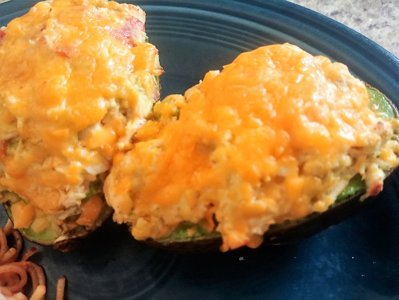Avocados stuffed with a cream cheese and chicken mixture, then topped with shredded cheddar and baked make a quick and delicious entree.