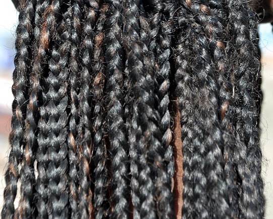 african braid hairstyle black braid hair ethnic / Getty Images