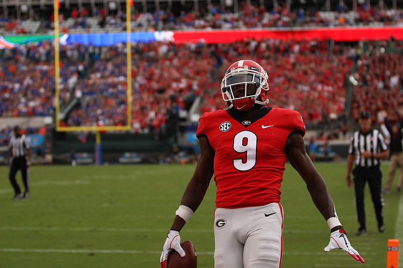 
Georgia receiver Jeremiah Holloman gets into the end zone with one of his two touchdown catches during last season's 36-17 win over Florida. / Georgia photo / Lauren Tolbert
