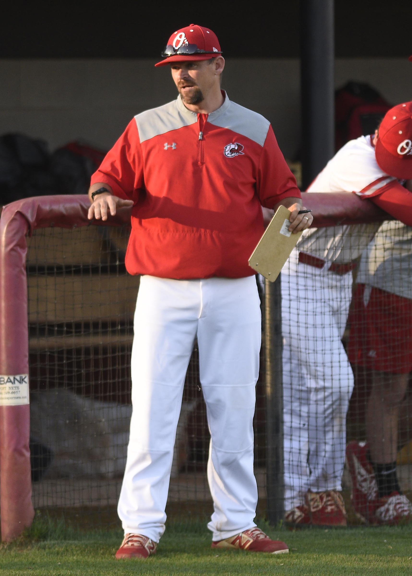 Ooltewah head coach Brian HItchcox seeks a ruling from the umpire. The Bradley Central Bears visited the Ooltewah Owls in TSSAA baseball action on April 9, 2019.