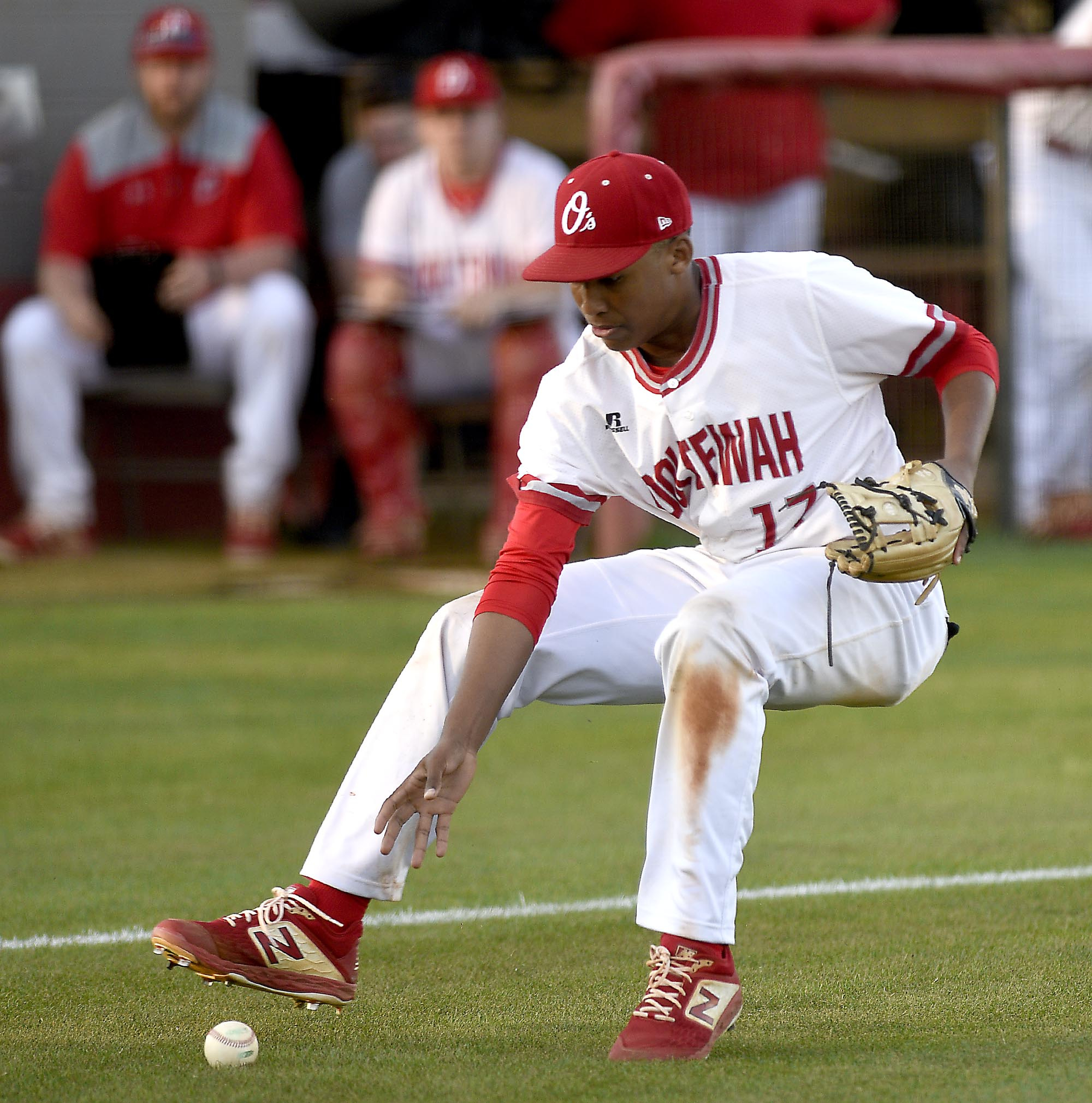 Ooltewah third baseman Kael Williams (17) charges in to field a Bradley bunt. The Bradley Central Bears visited the Ooltewah Owls in TSSAA baseball action on April 9, 2019.