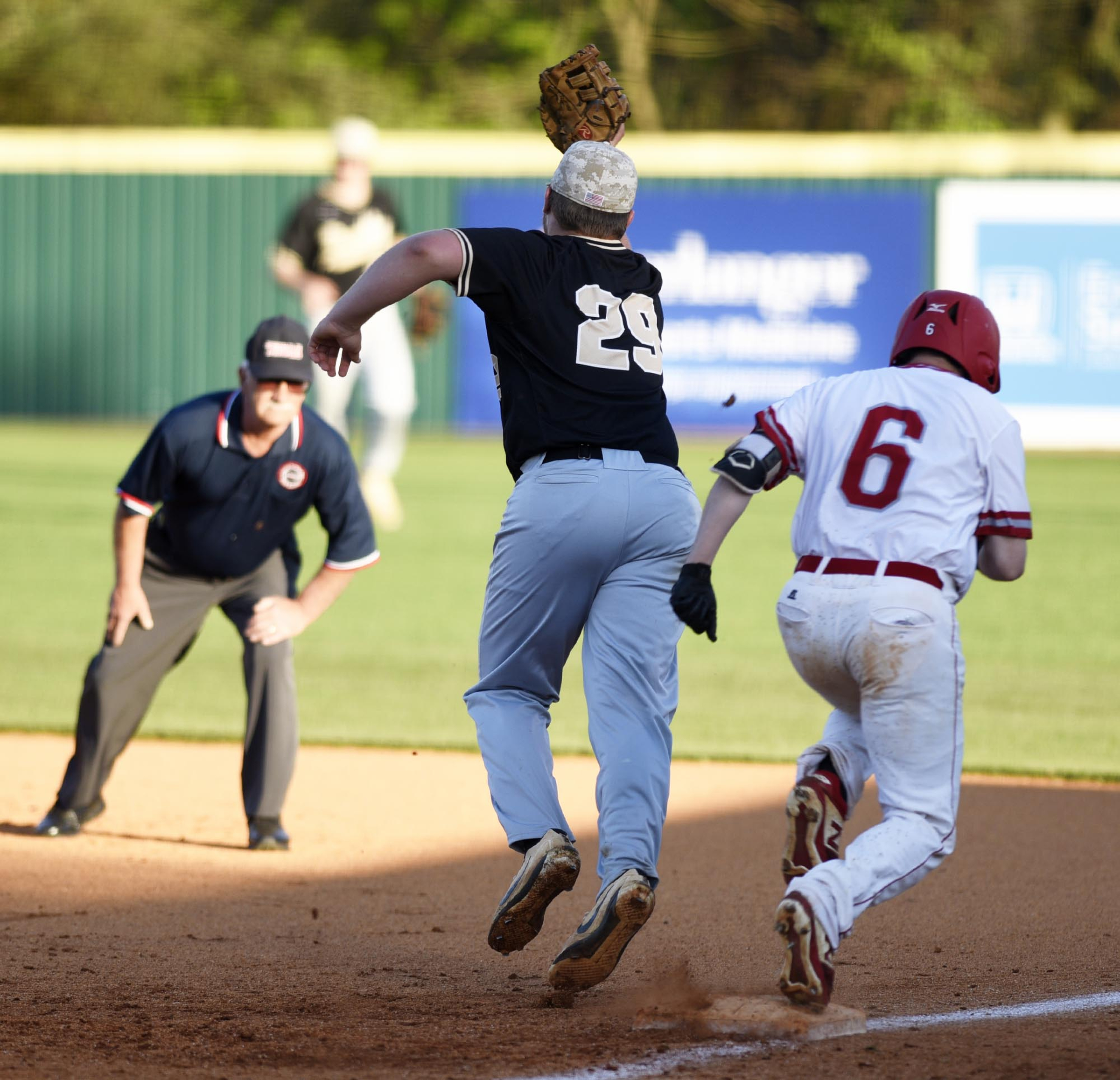 Ooltewah's Payton Keiser (6) is safe at first while Bradley's Jake Thompson (29) comes off the bag to make the catch. The Bradley Central Bears visited the Ooltewah Owls in TSSAA baseball action on April 9, 2019.