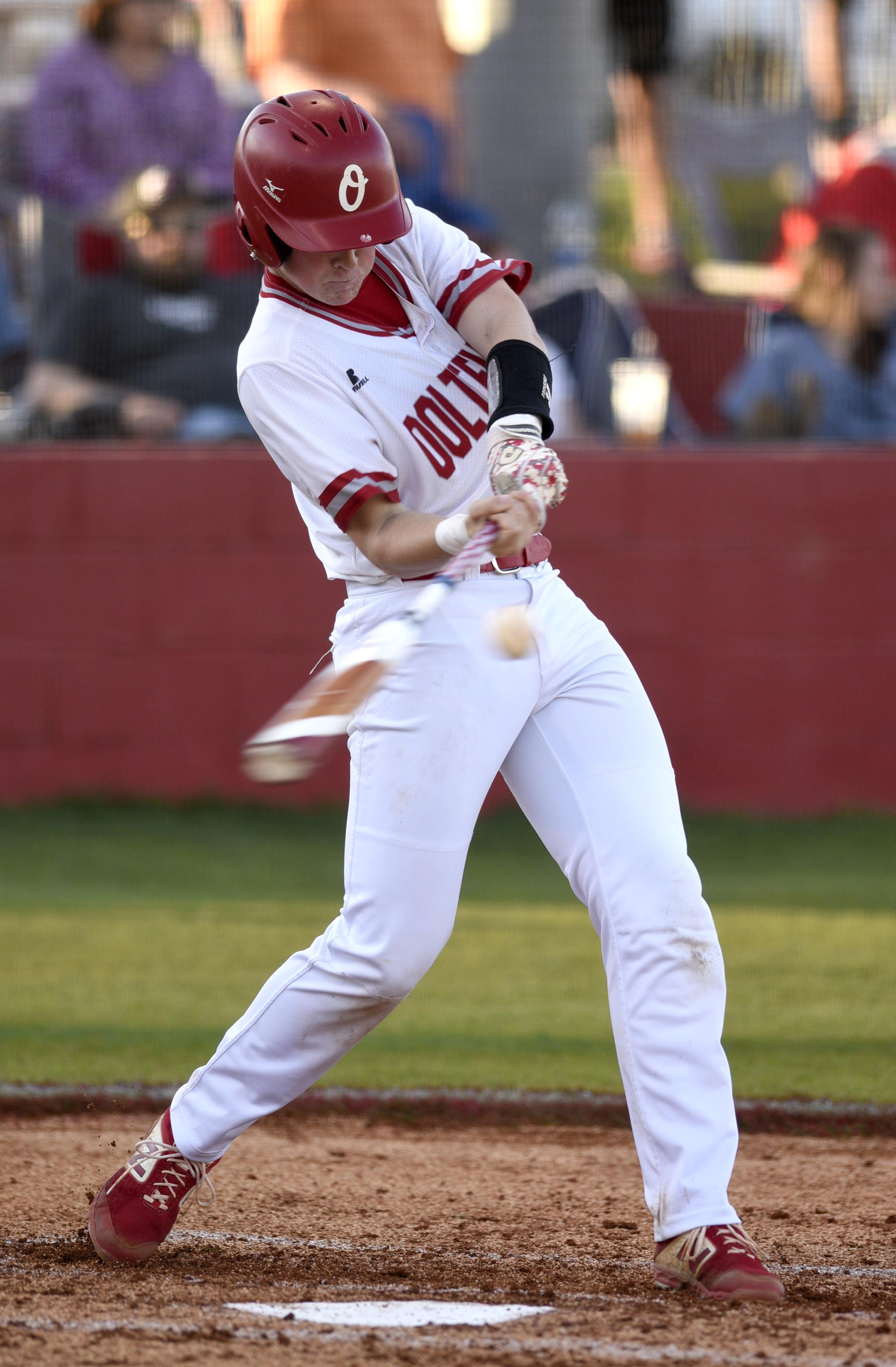 Ooltewah's Jacob Robinson (7) takes a cut at a pitch. Jax Howard (27) delivers the pitch as Bradley's Dylan Standifer (8) stands in at bat. The Bradley Central Bears visited the Ooltewah Owls in TSSAA baseball action on April 9, 2019.