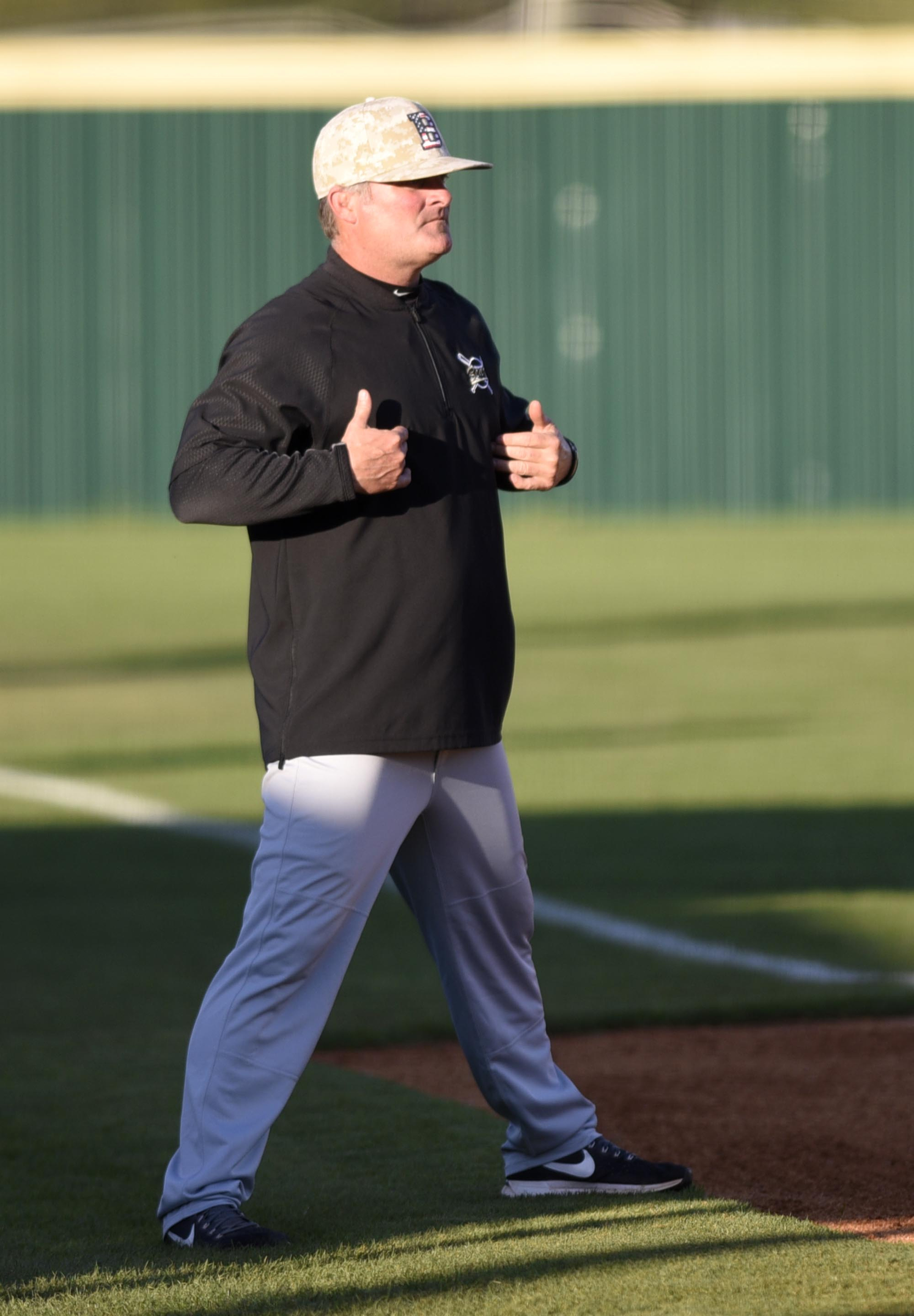 Bradley head coach Travis Adams gives the signals. The Bradley Central Bears visited the Ooltewah Owls in TSSAA baseball action on April 9, 2019.