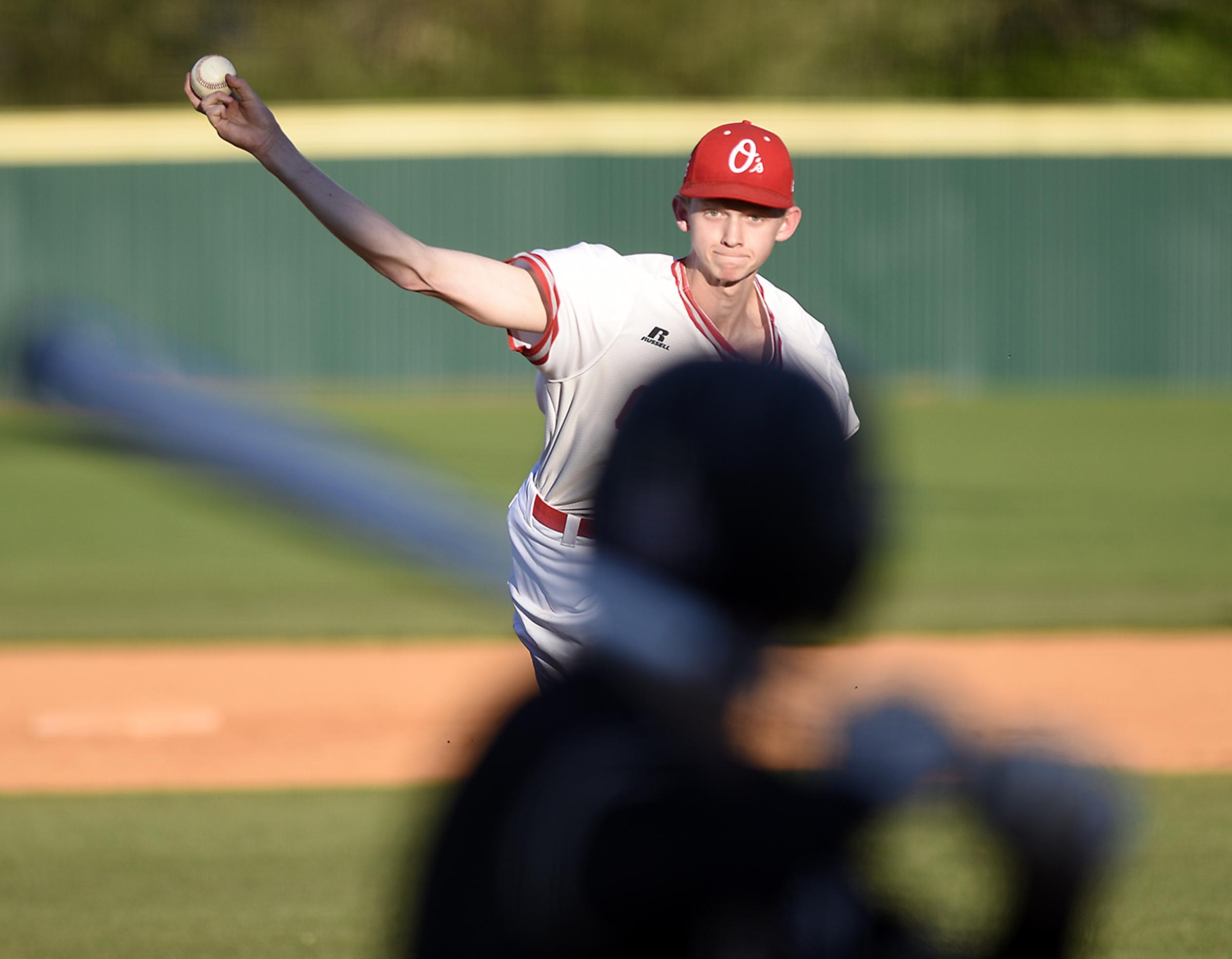 Ooltewah's Jax Howard (27) delivers the pitch as Bradley's Dylan Standifer (8) stands in at bat. The Bradley Central Bears visited the Ooltewah Owls in TSSAA baseball action on April 9, 2019.