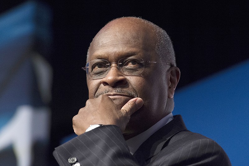 FILE - In this June 20, 2014 file photo, Herman Cain, CEO, The New Voice, speaks during Faith and Freedom Coalition's Road to Majority event in Washington.  President Donald Trump said Wednesday, April 10, 2019, that Cain is a "wonderful man," but it will be up to him to decide whether to go forward with a nomination to the Federal Reserve's seven-member board. (AP Photo/Molly Riley, File)