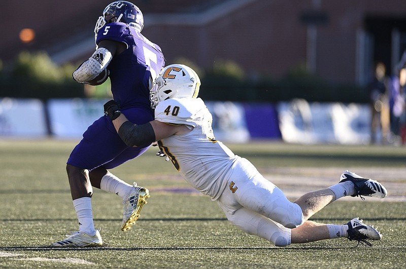 UTC linebacker Marshall Cooper tackles Western Carolina's Connell Young during their October 2018 game in Cullowhee, N.C.