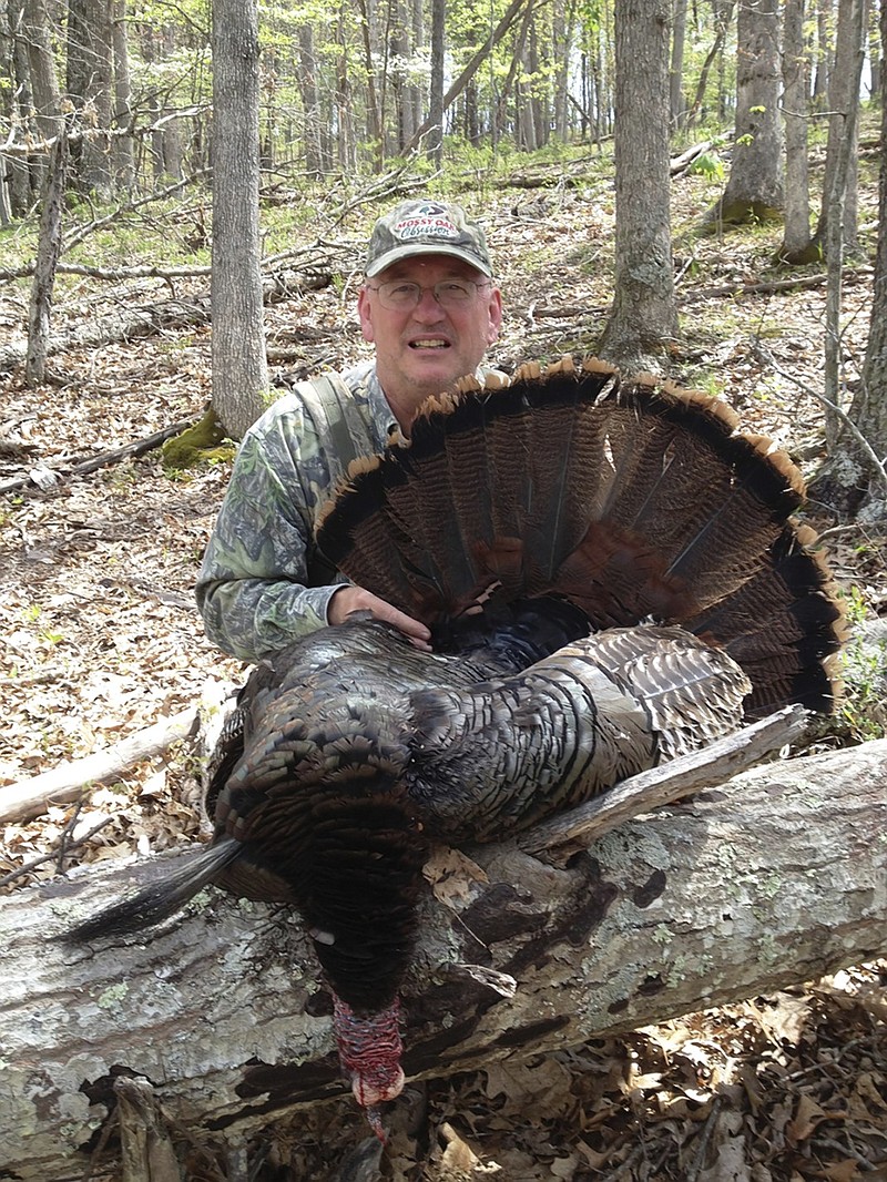 Outdoors columnist Larry Case shows off a gobbler killed in Summers County, W.Va. Case's love-hate relationship with turkey hunting tips enough toward love for him to keep going back to the woods every spring, despite the stupidity of it all.