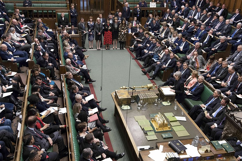 In this handout photo provided by the UK Parliament, Britain's Prime Minister Theresa May delivers her statement in the House of Commons in London, Thursday, April 11, 2019. Granted a Brexit reprieve by the European Union, British Prime Minister Theresa May is urging lawmakers to pause, reflect on the need for compromise _ and then fulfill their "national duty" to approve a Brexit deal and take Britain out of the EU. But there was little sign the U.K.'s divided and exhausted lawmakers had heeded the EU's plea not to waste the six months of extra time. (Jessica Taylor/UK Parliament via AP_