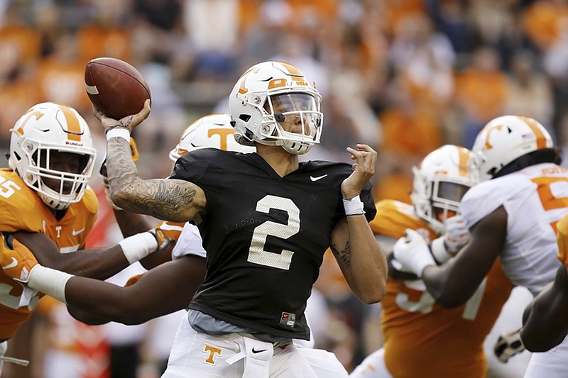 Jarrett Guarantano passes under pressure for the White team during Tennessee's Orange and White spring football game Saturday at Neyland Stadium in Knoxville.
