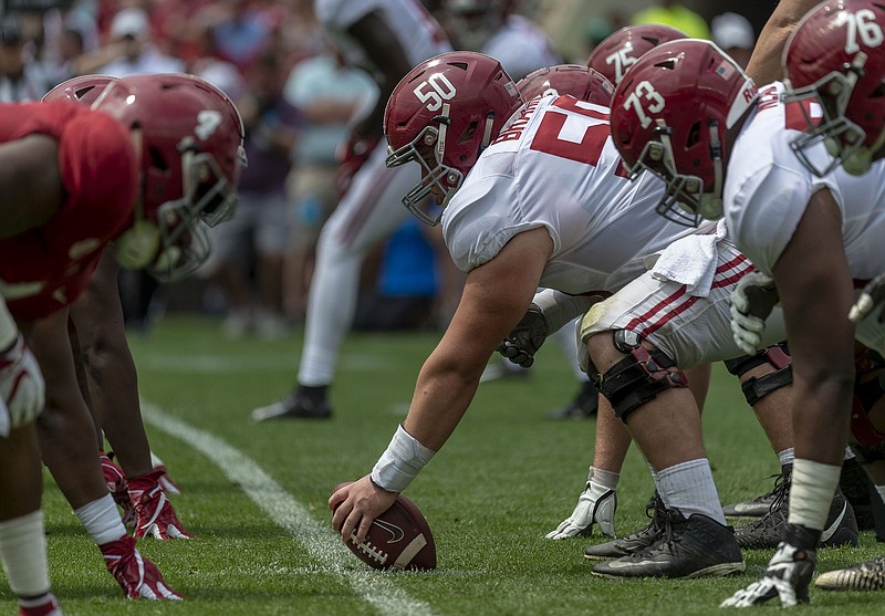 Alabama center Hunter Brannon (50) prepares to snap the ball during the first half of Alabama's A-Day spring football game Saturday in Tuscaloosa.