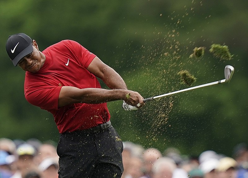 Tiger Woods hits a shot on the 12th hole at Augusta National Golf Club during the final round of the Masters on Sunday.
