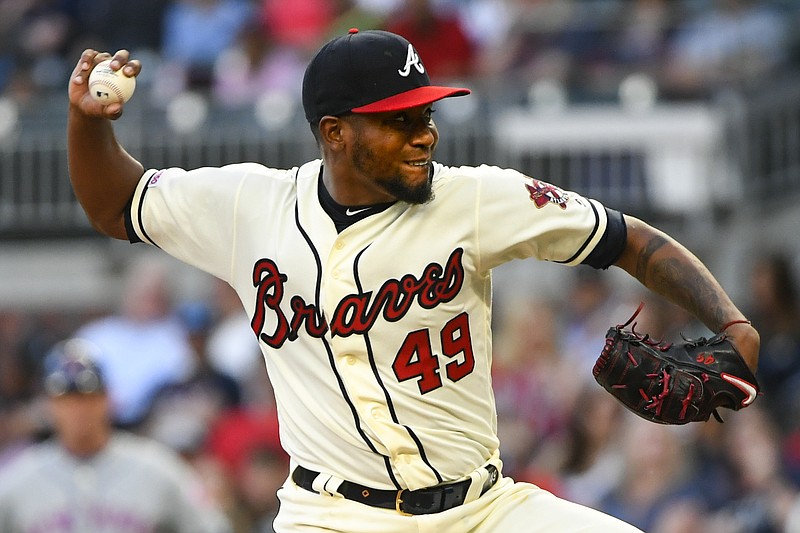 The Atlanta Braves' Julio Teheran pitches against the New York Mets during the first inning of Sunday night's game at SunTrust Park in Atlanta.