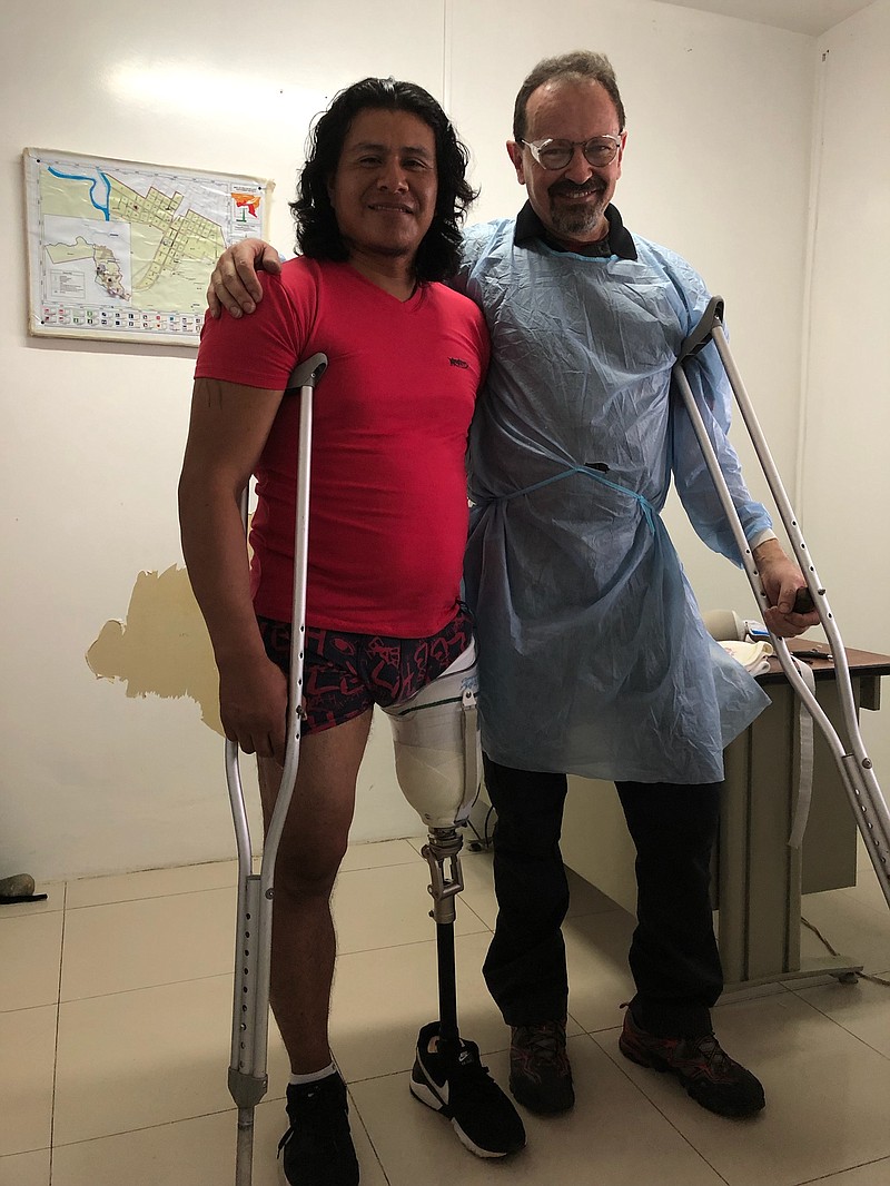 Govani, a 33-year-old from Tena, Ecuador, who lost his leg in a motorcycle accident, tries out his new prosthetic leg with Efren Ormaza, owner of the soon-to-close North Chattanooga restaurant Terra Nostra and founder of the Penipe Foundation. A fundraiser for the foundation is planned for April 24 from 6-9 p.m. at the restaurant. / Photo contributed by Efren Ormaza