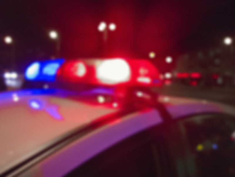 Red and blue lights of police car in night time, crime scene. Night patrolling the city. Abstract blurry image. policelight policelights / Getty Images