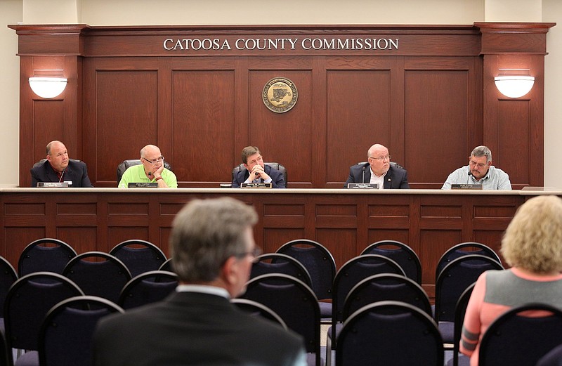 The Catoosa County Board of Commissioners listen to Dennis Thayer, the former emergency management and 911 director for Catoosa County, Tuesday, April 16, 2019, during his grievance hearing at the Catoosa County administrative office in Ringgold, Georgia. Thayer said the reasoning behind his firing was taken out of context.