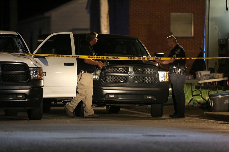 Staff photo by Erin O. Smith / 
Law enforcement works the scene of a Chattanooga police officer-involved shooting in the 2000 block of Cleveland Avenue Tuesday, April 16, 2019 in Chattanooga, Tennessee. The officers involved have been placed on administrative leave pending investigation.