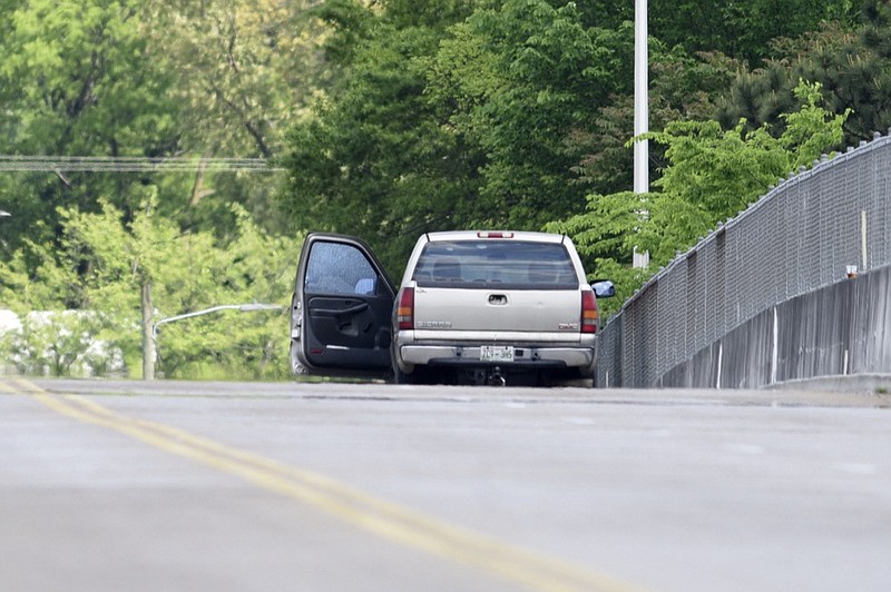 Staff photo by C.B. Schmelter / 
A vehicle is seen stopped along Bailey Avenue, over Northfolk Southern Railway's DeButts Yard, as police investigate a shooting along at the location on Thursday, April 18, 2019 in Chattanooga, Tenn.
