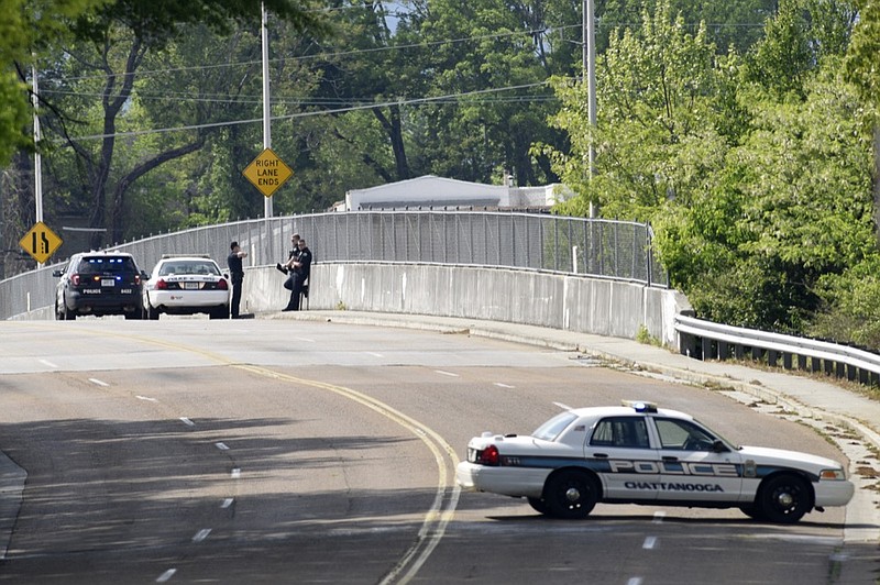 Staff photo by C.B. Schmelter / 
Police investigate a shooting along Bailey Avenue, over Northfolk Southern Railway's DeButts Yard, on Thursday, April 18, 2019 in Chattanooga, Tenn.
