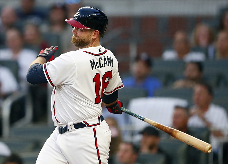 Atlanta Braves catcher Brian McCann follows through on a two-run double during the second inning of Wednesday's game against the Arizona Diamondbacks in Atlanta. The Braves lost 3-2.