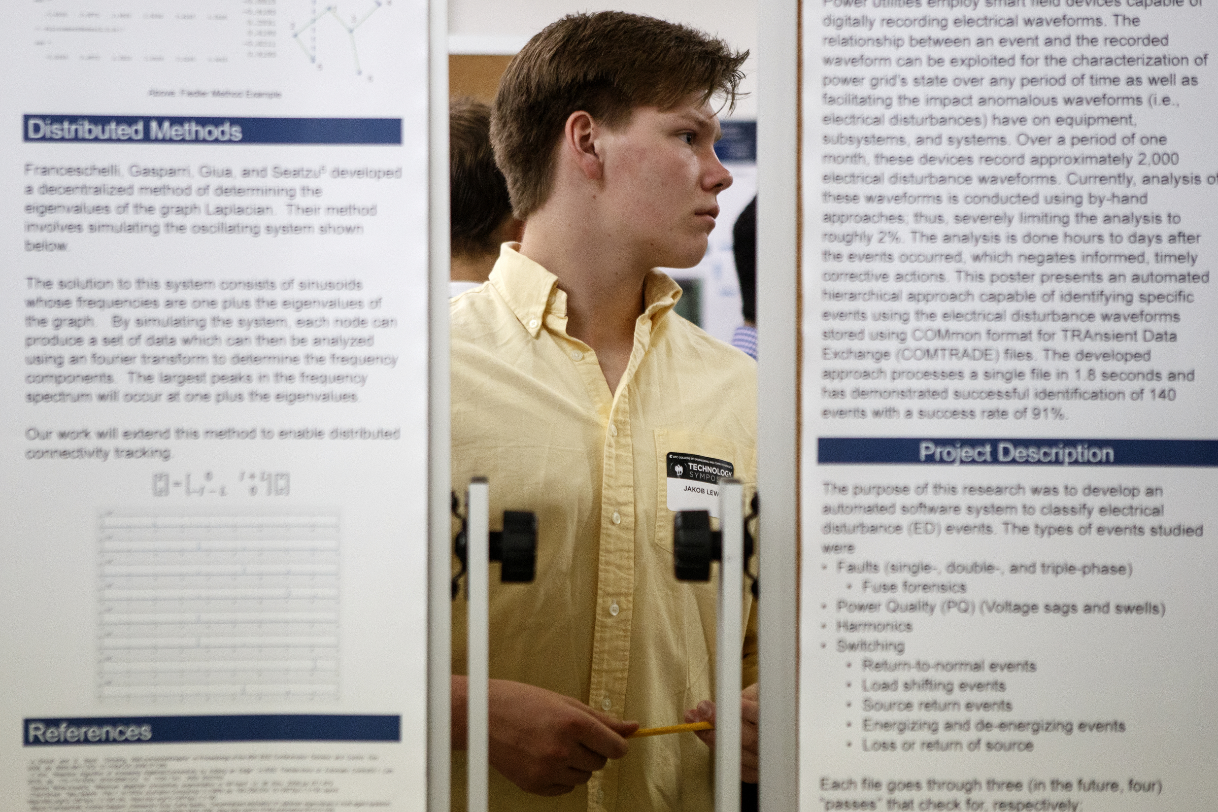Freshman engineering student Jakob Lewis looks at a display near his during the University of Tennessee at Chattanooga College of Engineering and Computer Science's Technology Symposium at the downtown Public Library on Thursday, April 18, 2019 in Chattanooga, Tenn.