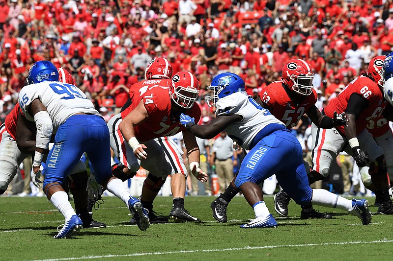 Georgia redshirt junior Ben Cleveland (74) has been fighting this spring to reclaim his starting spot at right guard, which he held late in the 2017 season and early last season.