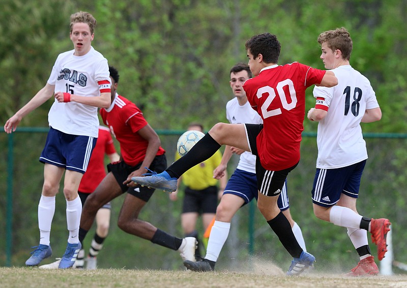 Signal Mountain's Clay Gallant (20) attempts to move the ball downfield during Thursday night's home match against Arts & Sciences.