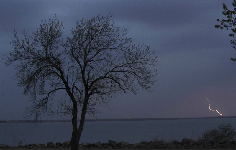 A thunderstorm moves across John Redmond Reservoir near Burlington, Kan., Wednesday, April 17, 2019. Several thunderstorms turned severe as they moved through the area. (AP Photo/Orlin Wagner)