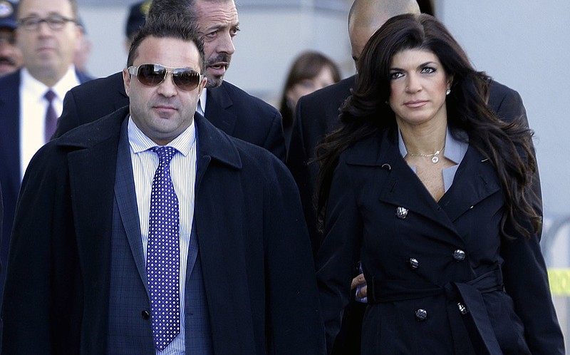 FILE - In this Nov. 20, 2013, file photo, Giuseppe "Joe" Giudice, left, and his wife, Teresa Giudice, of Montville Township, N.J., walk out of Martin Luther King Jr. Courthouse after a court appearance, in Newark, N.J. On Thursday, April 18, 2019, attorneys for Joe Giudice said that their client has lost his appeal to avoid deportation to Italy. (AP Photo/Julio Cortez, File)

