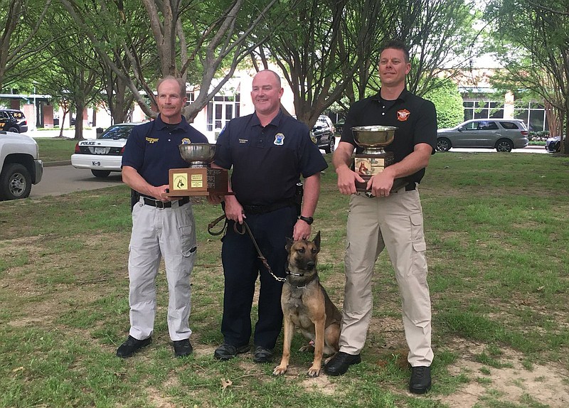 Chattanooga police officer Lucas Timmons and K-9 Burt earned the Overall Top Dog award at the United States Police Canine Association's Region 22 Field Trials, the department tweeted Thursday. Whitfield County sheriff's deputy Todd Thompson and his K-9 earned the top award for narcotics detection, the tweet states. Both teams train under Chattanooga police's head trainer, Officer Barry Vrandenburg. (Photo from twitter.com/ChattanoogaPD)