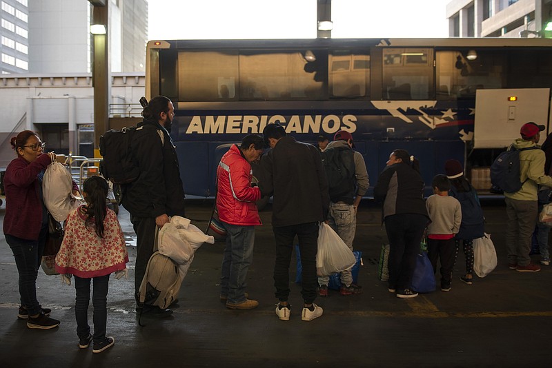 A group of asylum seekers wait to board a bus after being released by Border Patrol agents, in San Antonio, Texas, on April 2. President Donald Trump said Friday he was open to releasing migrants detained at the border into mostly Democratic "sanctuary cities," suggesting that the idea should make liberals "very happy" because of their immigration policies. (Callaghan O'Hare/The New York Times)