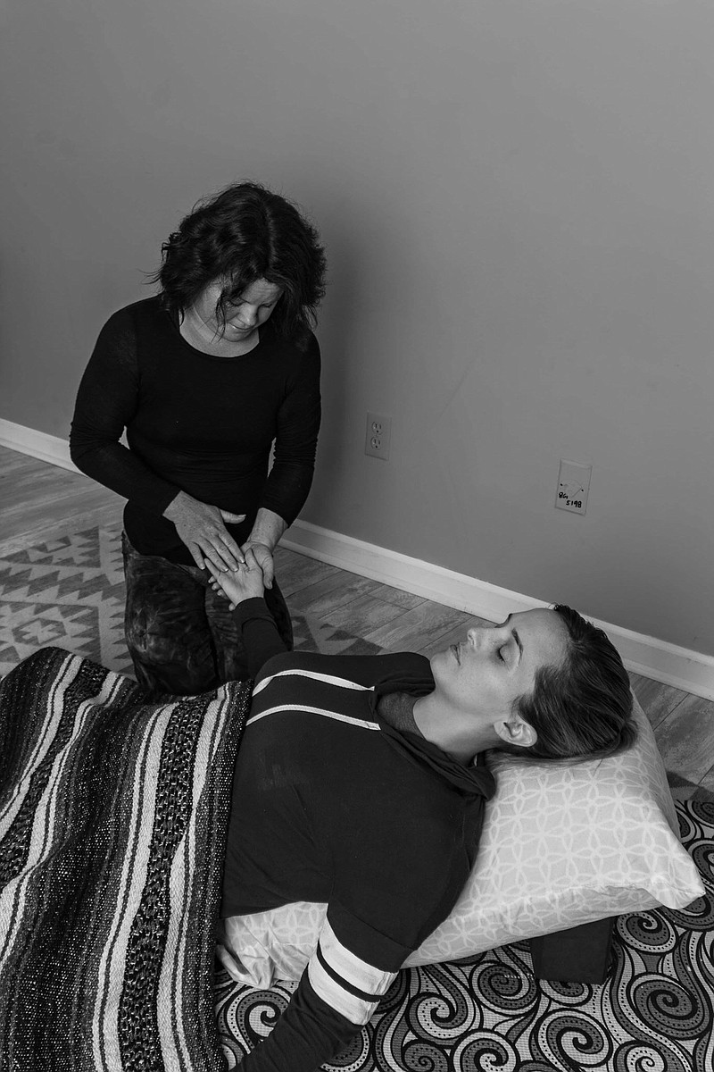 Mattie Bearden relaxes during a Spa Yoga session with Amy Darby. Darby is certified in AromaTouch therapy, a clinical application of essential oils. (Contributed photo)