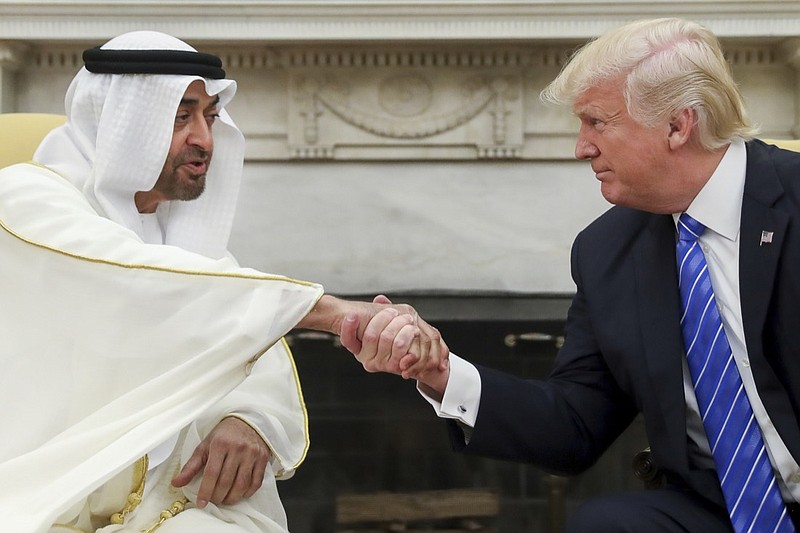 In this May 15, 2017, file photo, President Donald Trump shakes hands with Abu Dhabi's crown prince, Sheikh Mohammed bin Zayed Al Nahyan, in the White House in Washington. Sheikh Mohammed, one of the most-powerful leaders in the United Arab Emirates, has found himself entangled in special counsel Robert Mueller's report on U.S. President Donald Trump and Russian interference in America's 2016 election. (AP Photo/Andrew Harnik, File)