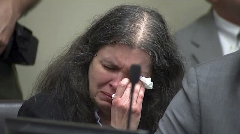 In this photo from video by KABC-TV, Louise Turpin sobs and dabs her eyes as one of her children speaks during a sentencing hearing Friday, April 19, 2019, in Riverside, Calif. David and Louise Turpin, who pleaded guilty to years of torture and abuse of 12 of their 13 children, have been sentenced to life in prison with possibility of parole after 25 years. (KABC-TV via AP, Pool)

