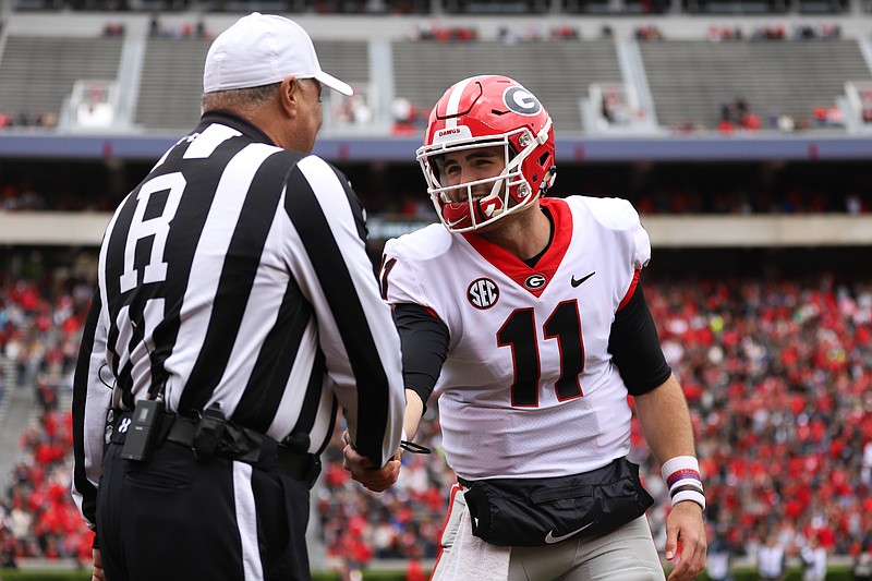 Georgia junior quarterback Jake Fromm shakes hands with the referee during Saturday afternoon's G-Day spring game in Sanford Stadium.