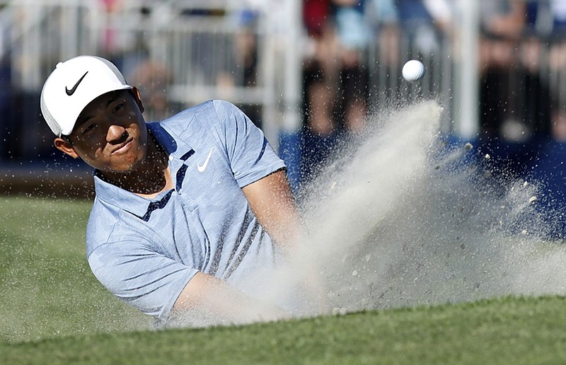 C.T. Pan blast out of a bunker on the 17th hole at Harbour Town Golf Links during Sunday's final round of the RBC Heritage on Hilton Head Island, S.C. Pan closed with a 4-under 67 and finished at 12-under 272 for his first PGA Tour victory